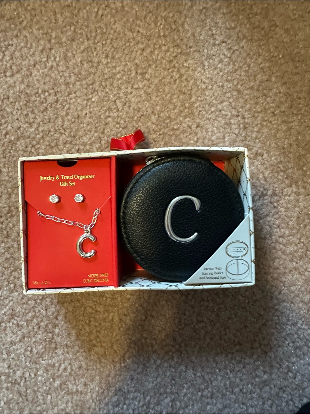 Monogram 'C' necklace, earrings, and jewelry case